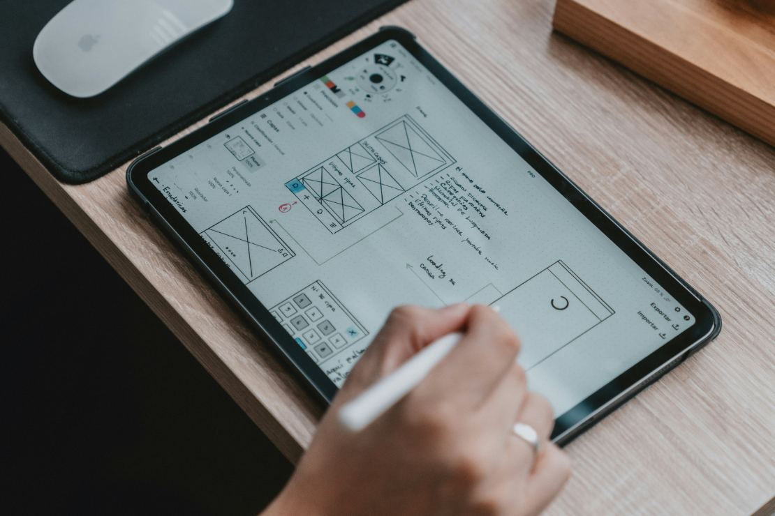 Image for Concept phase - person doing wireframe sketches in ipad